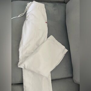 Ellesse white track pants in size small